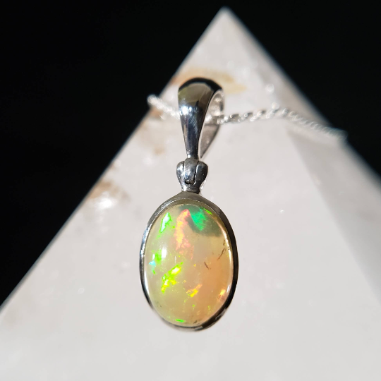 Fascinating - dainty - crystal deals opal pendant - faceted on both sides - Ethiopia - UNIQUE!