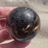 Flashy Nuummite Premium Sphere - Genuine Greenland Crystal Ball - Empath Protection 1.6" Palm Stone Orb - Blue Gold Flash