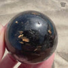 Flashy Nuummite Premium Sphere - Genuine Greenland Crystal Ball - Empath Protection 1.6" Worry Stone Orb - Blue Gold Flash