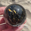 Flashy Nuummite Premium Sphere - Genuine Greenland Crystal Ball - Empath Protection 1.6" Palm Stone Orb - Blue Gold Flash